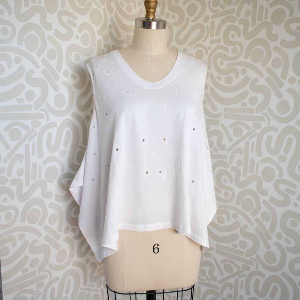 Handkerchief Hem Cut T-Shirt with Embroidered Eyelets.